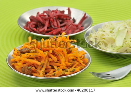 Grated carrots red beet and white cabbage salad