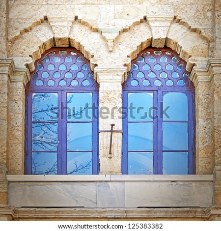 A pair of blue tinted windows from a mosque in the turkish city of Istanbul.