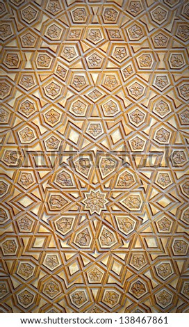An artistic carved pattern in wood of an islamic arabic nature.