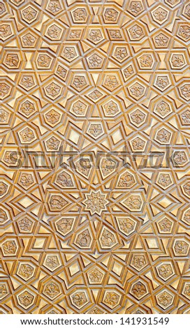 An artistic carved pattern in wood of an islamic arabic nature.