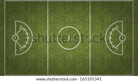 An overhead view of a womens lacrosse playing field with white markings painted on grass.