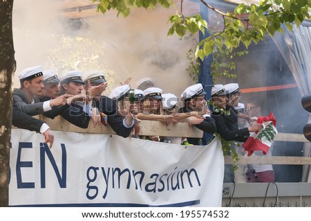 HELSINGBORG, SWEDEN - JUN 05: Graduates from different schools take part in a celebration parade throught the town centre on June 05, 2013 in Helsingborg, Sweden.