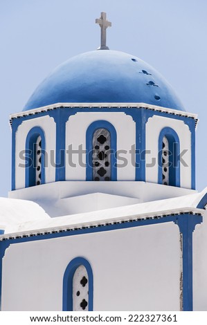 One of the many blue domed churches that adorn the greek island of santorini.