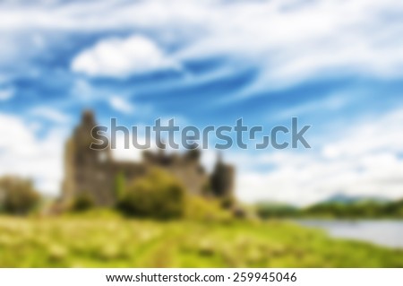 A blurred background image of some scottish castle ruins