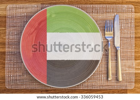 Dinner plate with the flag of the United Arab Emirates on it for your international food and drink concepts.