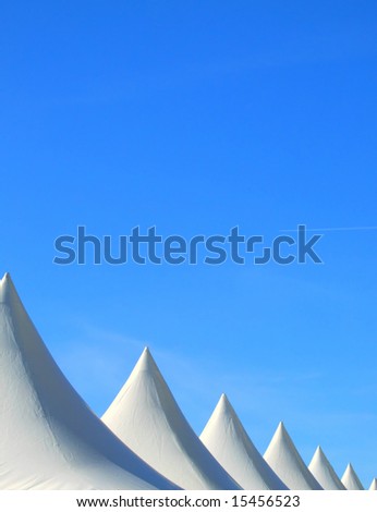 background Image of the tops of market stall tents at a local festival