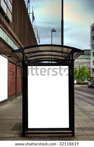 A high dynamic range image of a bus stop with a blank billboard for your advertising