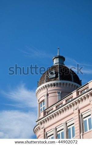 grand old apartments set against a blue sky background with room for your text