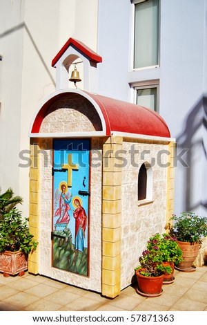A view of a small church for one in the town of Platanias on the greek island of Crete.