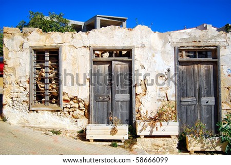 A view of an old crumbling building in the greek town of Platanias.