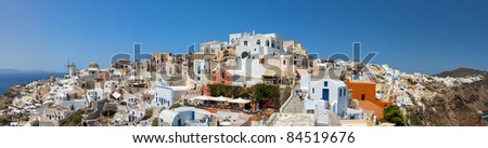 A panoramic image of the village of Oia on the greek island of Santorini.