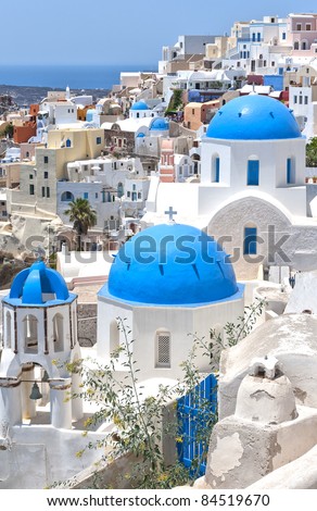 A view of a few of the famous blue domed churches from Oia on the greek isle of Santorini.