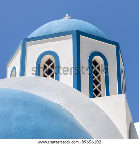 One of the many blue domed churches that adorn the greek island of santorini.
