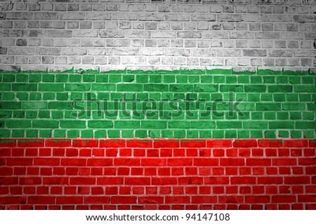 An image of the Bulgaria flag painted on a brick wall in an urban location