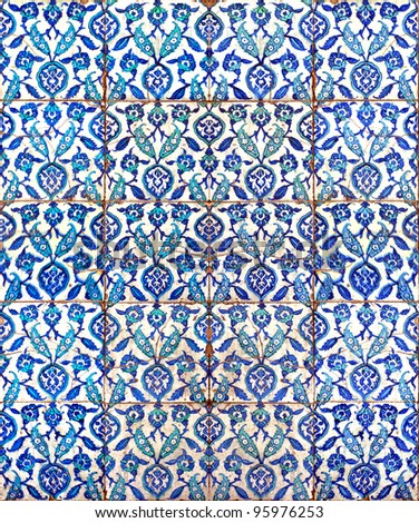 A seamless background image of ancient hand painted ceramic tiles from an islamic mosque.