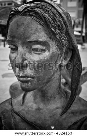 Face of a woman bronze statue