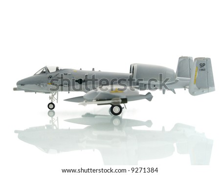 military miniature toy airplane on white background