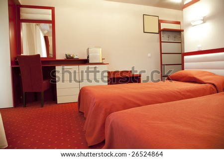 hotel room with red and beige four stars empty