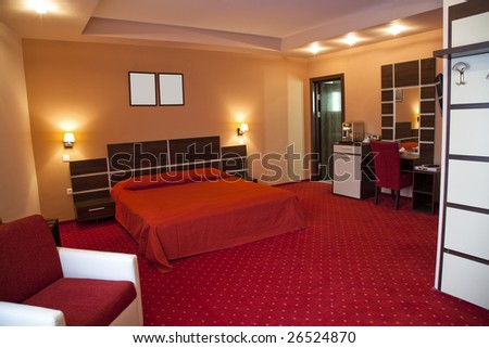 hotel room with red and beige four stars empty