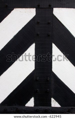 Decorative panel details on a Tudor / medieval black and white half-timbered building.
