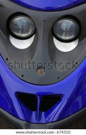Detail of a motor-scooter giving an indication of a humerous face.
