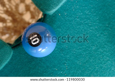 Playing pool. Ball number 10 is going to fall.