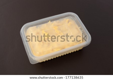 Chicken stroganoff closed package for freezing or to go on brown leather background.