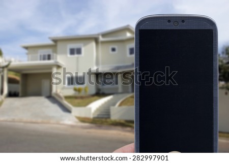 Smatrphone and house. Idea for smartphone home security system, monitoring system, real state applications, contractor, architecture, house improvements,  and others.