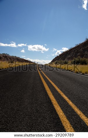A highway running through the back country of New Mexico.