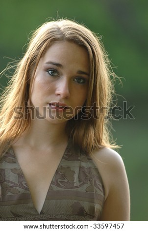 A naturally beautiful young woman with an  expressive face.