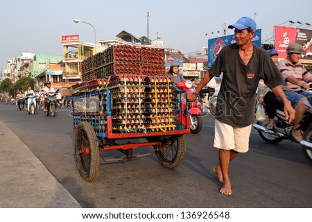 MY THO, VIETNAM - FEBRUARY 13: Vendor on February 13, 2012 in My Tho, Vietnam. Vietnams trade turnover in the first quarter hit US$29.76 billion, showing a year-on-year increase of 19.8 percent.