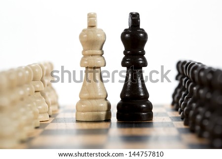 Two kings - black and white chess figures on chess board