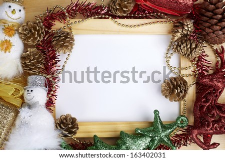 Christmas decorations with wood frame on the wood background