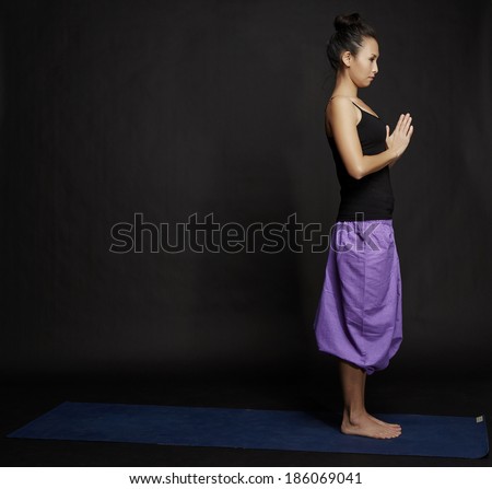 Asian young beautiful yoga posing on a black studio background-Studio Shooting.