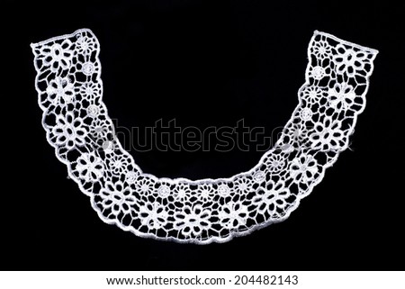 Close up white lace trim isolated white. Fabric texture.