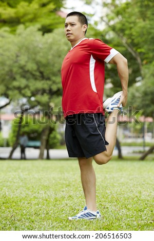Asian fitness man stretching at the park - fitness concepts sports exercises.