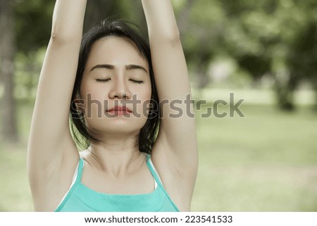 Close up stretching woman in outdoor exercise smiling happy doing yoga stretches after running-Beautiful happy smiling sport fitness