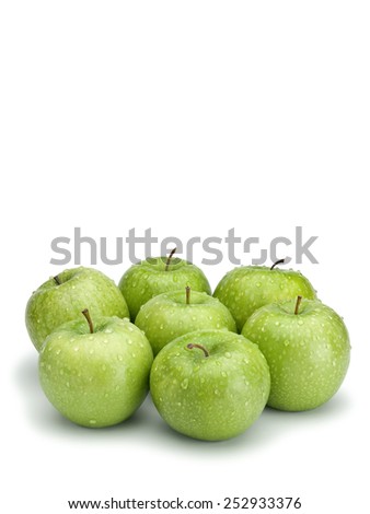 Seven green apples isolated on white