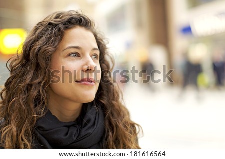Portrait of an attractive young woman in a warm positive gaze