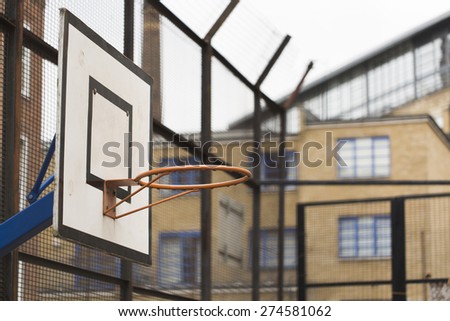 Basketball ring and backboard in a housing estate or projects