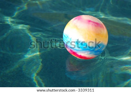 a colorful toy ball floating in a swimming pool