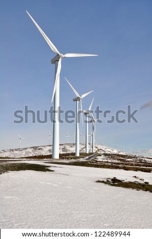Wind turbines farm in winter, Elgea range (Basque Country)