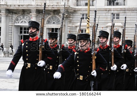 MADRID, SPAIN - FEBRUARY 12: Royal Guards participate in the Changing of the Guard at Royal Palace on february 12, 2014 in Madrid, Spain.