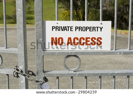 Private Property - No Access Sign on a Padlocked Gate