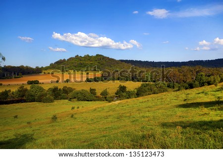 Large farm property against a blue sky