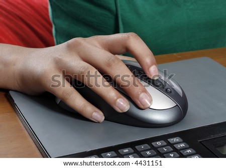 Woman hand on computer mouse.