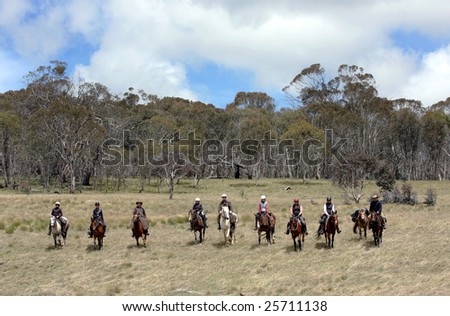 A group of horseriders in the Australian outback