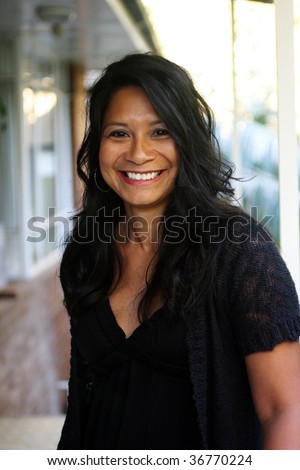 stock photo Attractive Latino women smiling at the camera