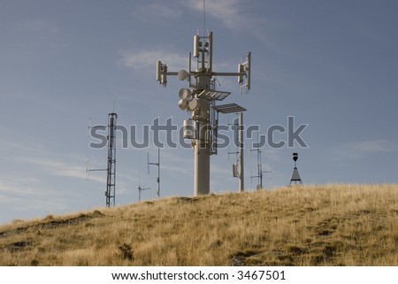 Mobile Phone tower on top of a large hill