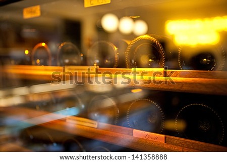 Wine Bottles rack. Glassy wine rack in the french restaurant